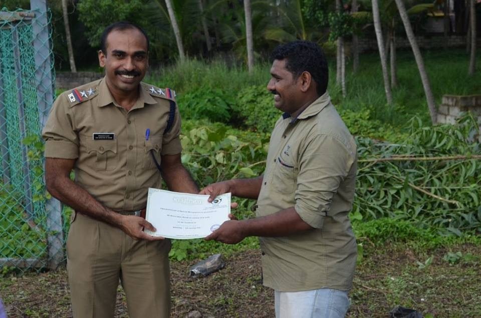 Handing a sapling to an official